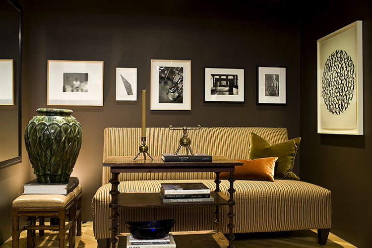 Light and dark: Graphic prints pop against chocolate- hued walls in a study of color contrasts.