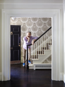 Farrow and Ball lotus wallpaper, a nod to the owner’s life in Asia, sets a graphic backdrop to the foyer’s original staircase.
