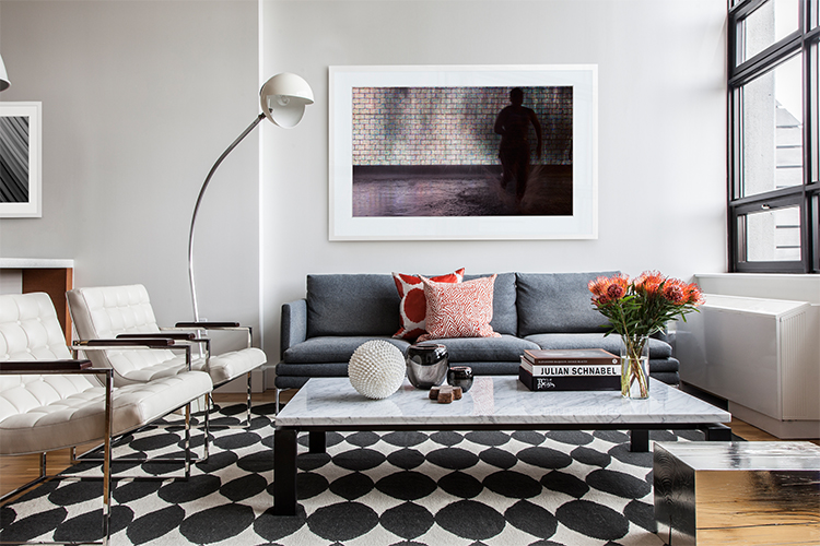 Sofa by Zanotta and chairs by Room. Rug from Dwell Studio and floor lamp is vintage from Gueridon.