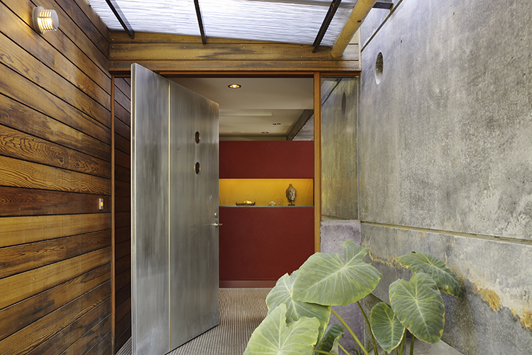 The main entranceway creates a sense of refuge after passing the home’s 12-inch thick concrete walls. Natural materials, an intimate human scale and even an indoor-outdoor water feature connects the home’s threshold.