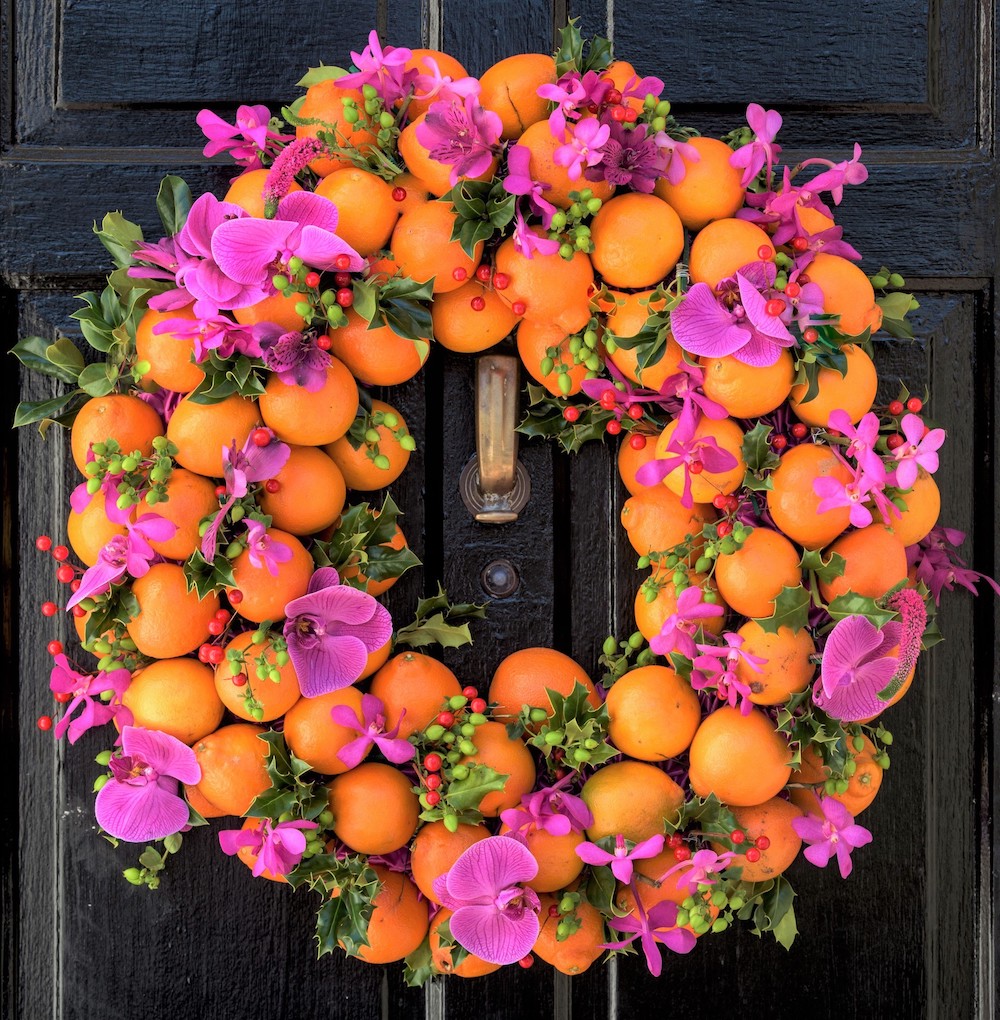 holiday wreaths made with oranges and fresh orchids
