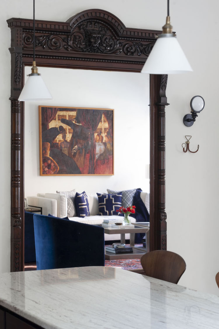 an antique mirror reflects the living room in a rittenhouse square home